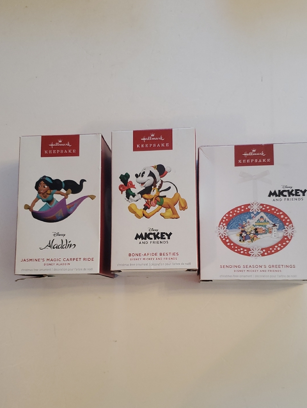 Hallmark Keepsake Ornaments — White & Red Disney Trio